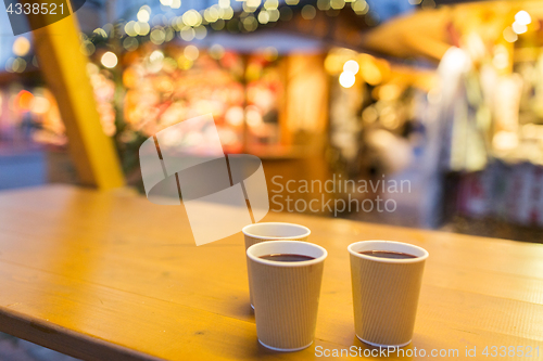 Image of mulled wine in paper cups at christmas market