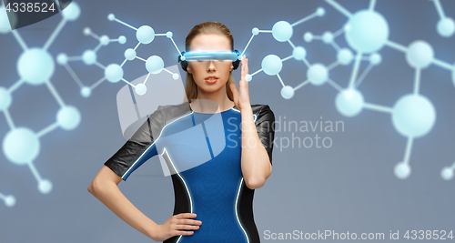 Image of woman in virtual reality 3d glasses with molecules