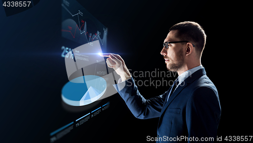Image of businessman working with virtual pie chart