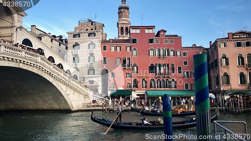 Image of Gondoliers at the famous Rialto Bridge of Venice, Italy