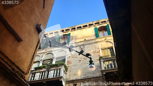 Image of Typical scene of Venice, Italy, with old houses and pigeons