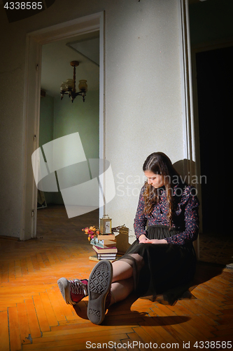 Image of Young girl in black vintage dress 