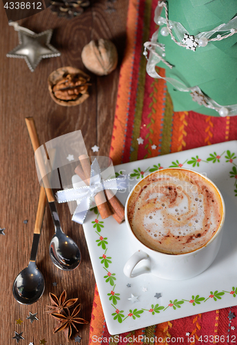 Image of Cup of coffee and Christmas decorations