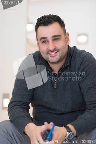 Image of man sitting on the stairs