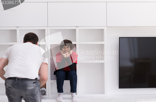 Image of young boys posing on a shelf