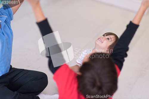 Image of young boys having fun on the floor