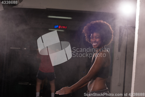 Image of black woman preparing for climbing workout