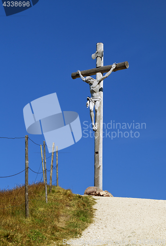 Image of Cross on the top of a mountain in Dolomites