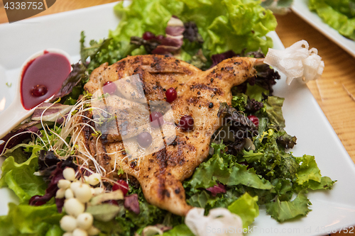 Image of quail roasted with sweet and sour cranberry sauce