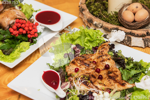 Image of quail roasted with sweet and sour cranberry sauce