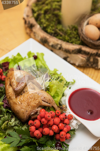 Image of quail roasted with sweet and sour cranberry sauce