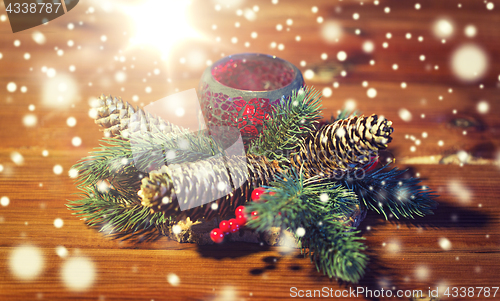 Image of christmas fir branch decoration and candle lantern