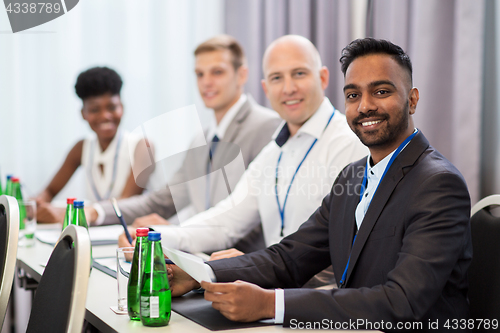 Image of happy business team at international conference