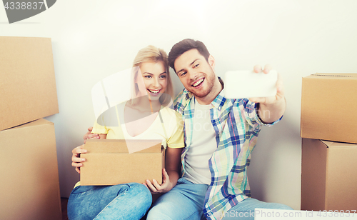 Image of couple with taking smartphone selfie and moving