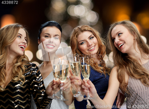Image of happy women drinking champagne at christmas