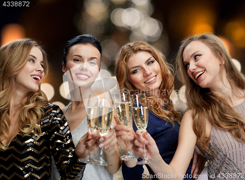 Image of happy women drinking champagne at christmas