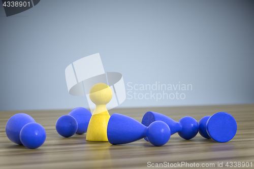 Image of game figures one standing five lying