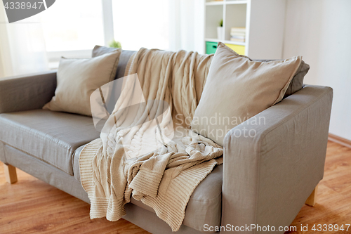 Image of sofa with cushions at cozy home living room