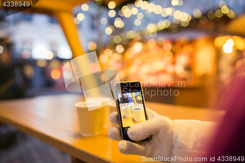 Image of mulled wine picture on smartphone at christmas