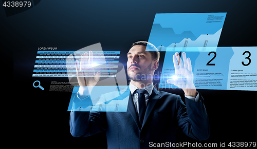 Image of businessman with stock charts on virtual screens