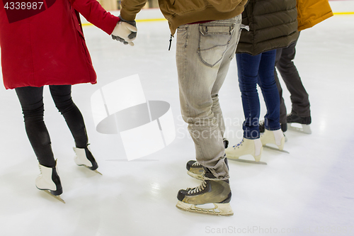 Image of close up of friends on skating rink