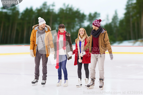 Image of friends holding hands on outdoor skating rink