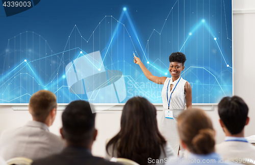 Image of group of people at business conference or lecture