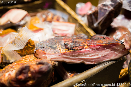 Image of smoked meat products at market or butcher shop