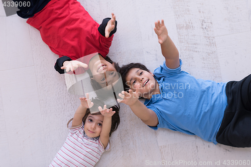 Image of young boys having fun on the floor