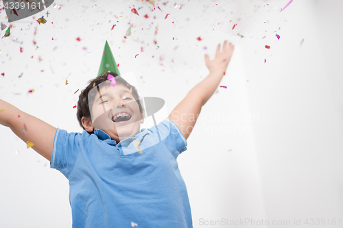 Image of kid blowing confetti