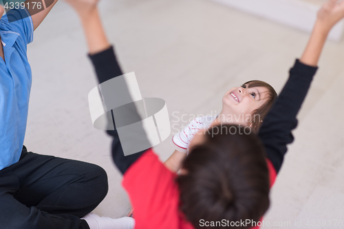 Image of young boys having fun on the floor