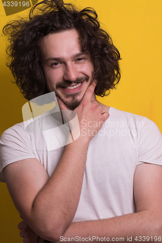 Image of young man with funny hair over color background