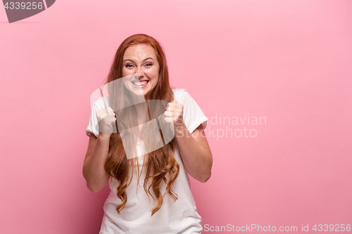 Image of Portrait of young woman with happy facial expression