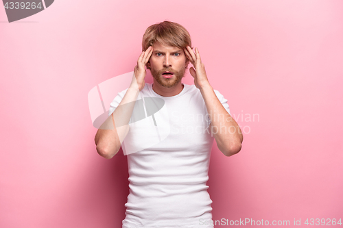 Image of Studio shot of thoughtful young man