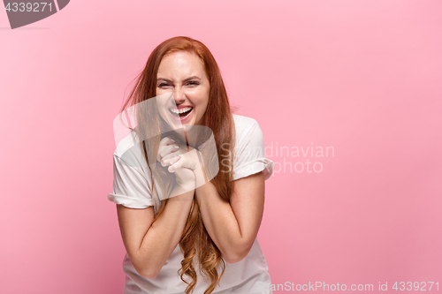 Image of Portrait of young woman with happy facial expression