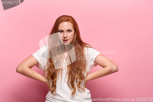 Image of The beautiful woman is offended on pink studio