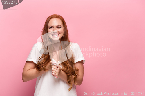 Image of Portrait of young woman with happy facial expression