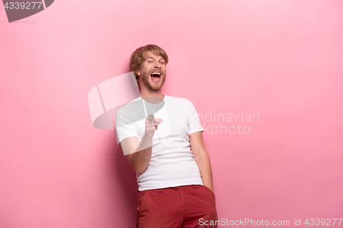 Image of Portrait of young man with happy facial expression