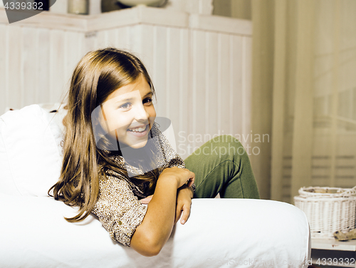 Image of little cute brunette girl at home interior happy smiling close u