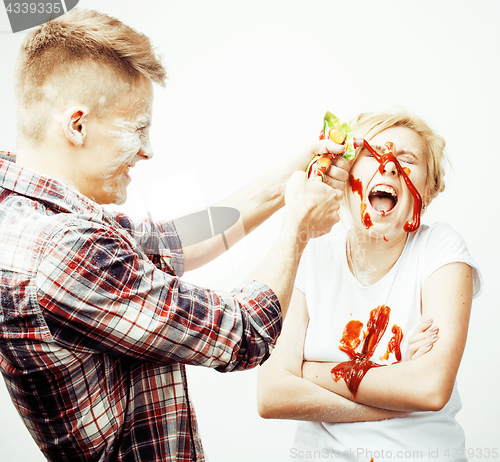 Image of young pretty couple, lifestyle people concept: girlfriend and boyfriend cooking together, having fun, making mess isolated on white background 