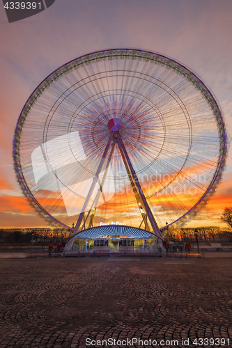 Image of Place de la Concorde at sunset. Ferris wheel and Egyptian obelis