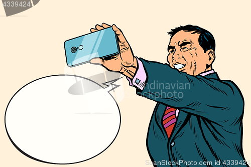 Image of Asian businessman makes selfie