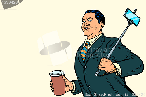 Image of Asian businessman with a selfie stick and coffee