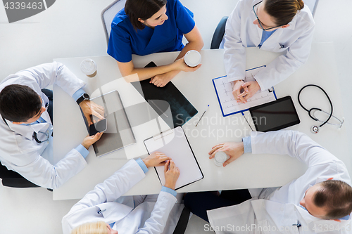 Image of group of doctors having coffee break at hospital