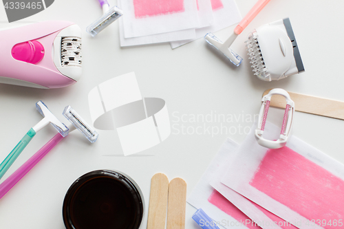 Image of hair removal wax, epilator and safety razor