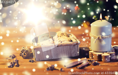 Image of close up of christmas oat cookies on wooden table