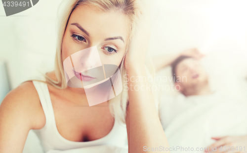 Image of awake woman having insomnia in bed