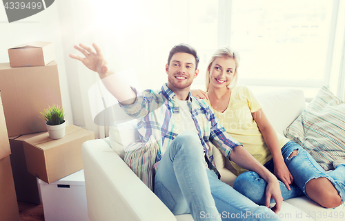 Image of couple with boxes moving to new home and dreaming