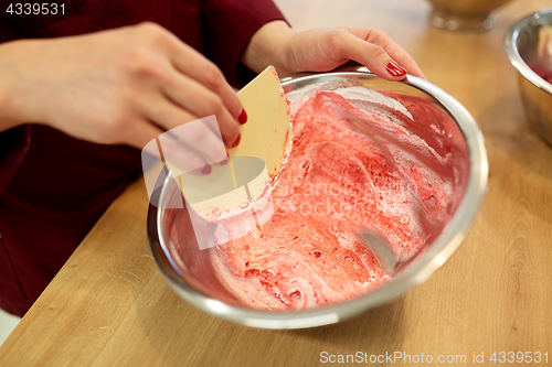 Image of chef making macaron batter at confectionery