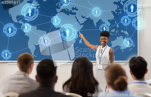 Image of group of people at business conference or lecture